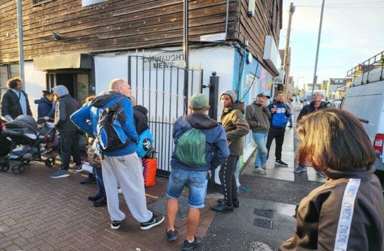 Homeless people gather at Meals for the Homeless to pray for King Charles III after hearing of death of Queen Elizabeth