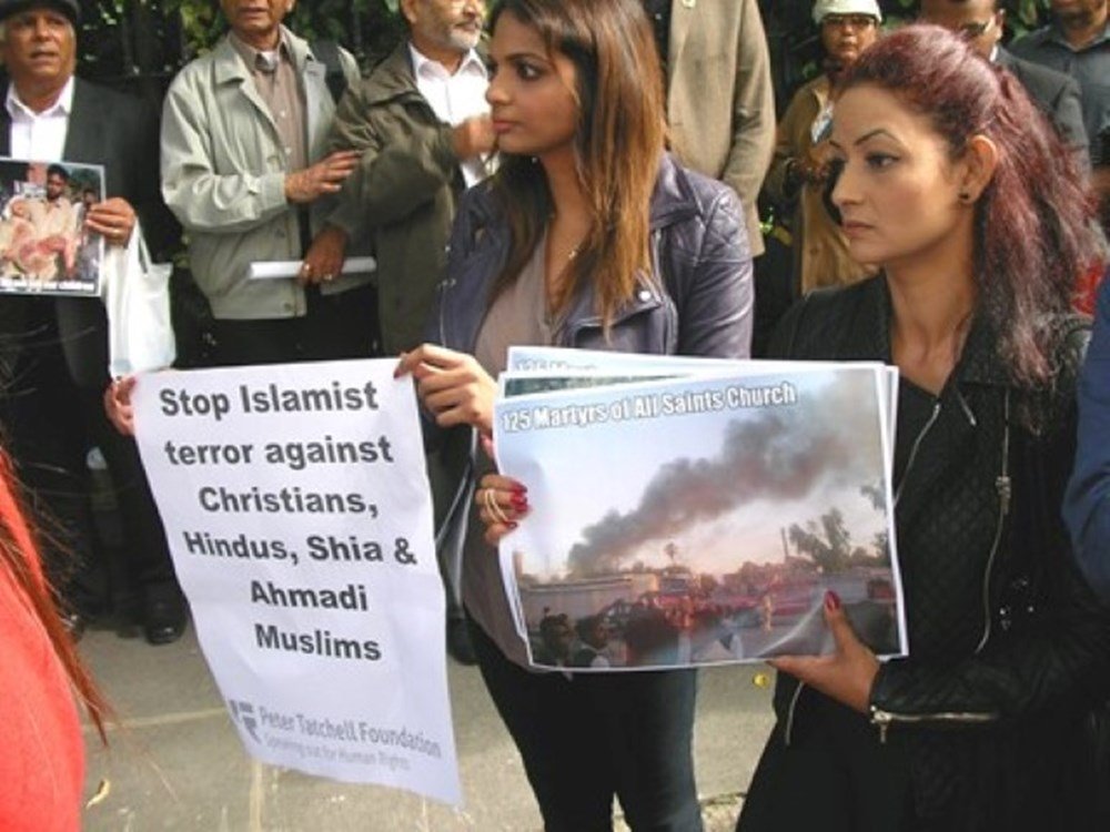 Illiterate school employees accused of blasphemy after they burnt loose scraps of paper while cleaning school cupboard