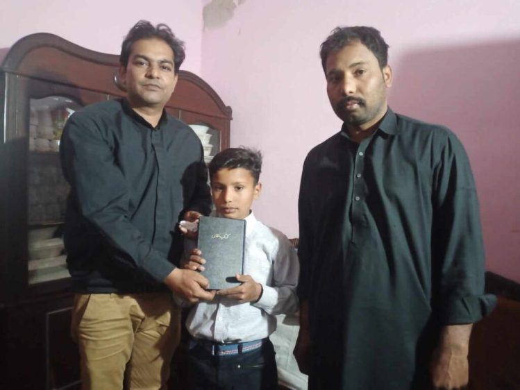 Zaigham Masih receives printed Bible